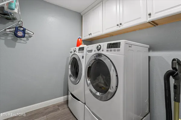 a view of a house with large trees