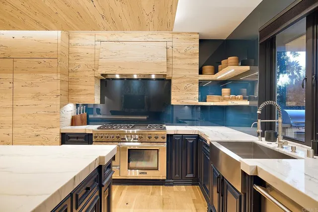 a kitchen with a stove and a sink