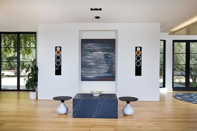 a view of open kitchen with furniture and wooden floor