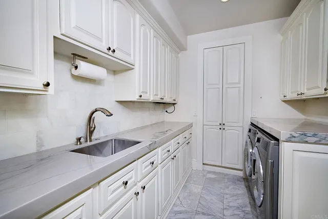 a kitchen with stainless steel appliances granite countertop a sink and dishwasher