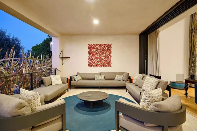 a living room with furniture and a large window