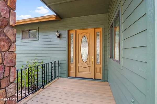 a view of a door and wooden floor