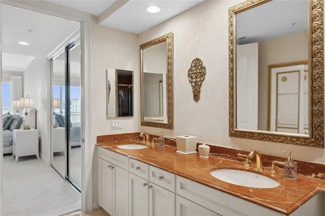 a bathroom with a glass shower door