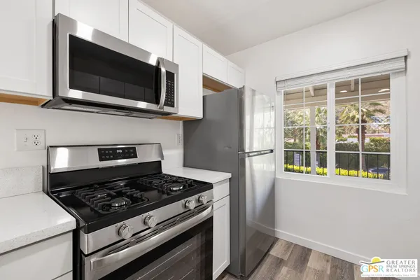 a kitchen with a stove and a microwave
