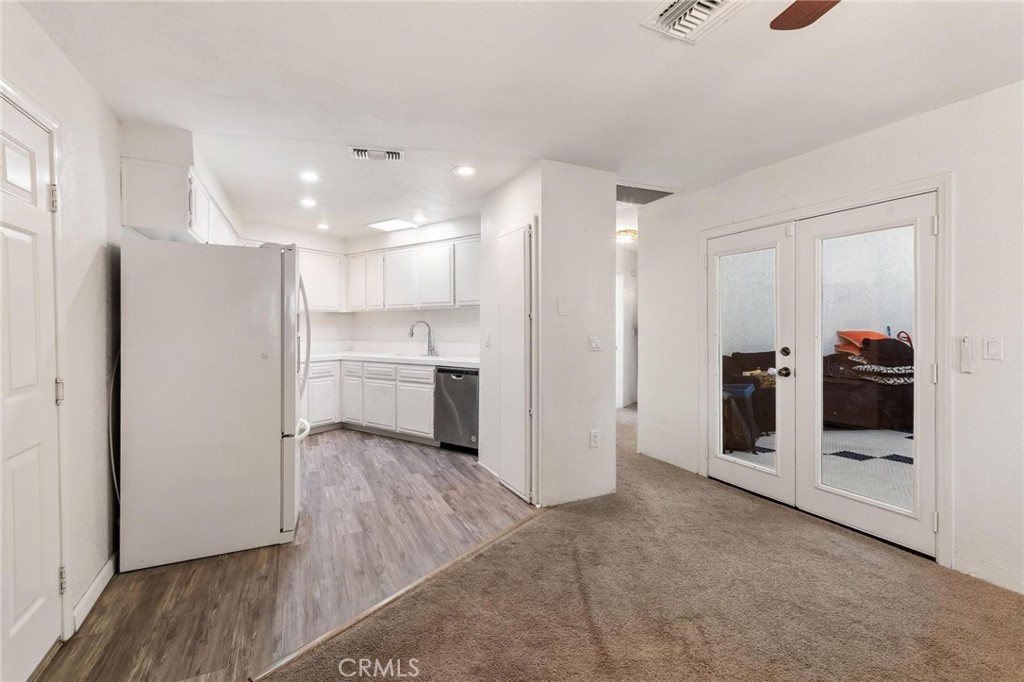 1076 Occidental Circle Redlands, CA 92374 - Photo 18 of 28 a view of a kitchen with a refrigerator and a stove top oven