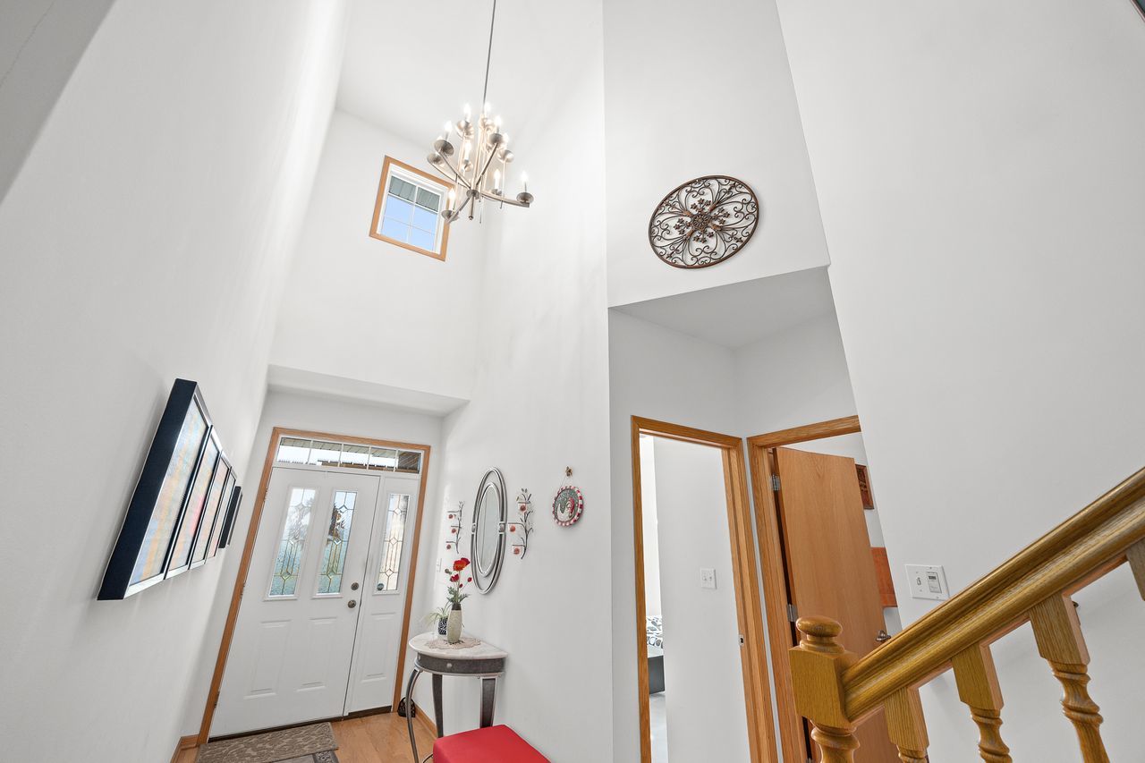 1343 Camelot Lane Lemont, IL 60439 - Photo 12 of 37 a view of entryway with stairs and wooden floor