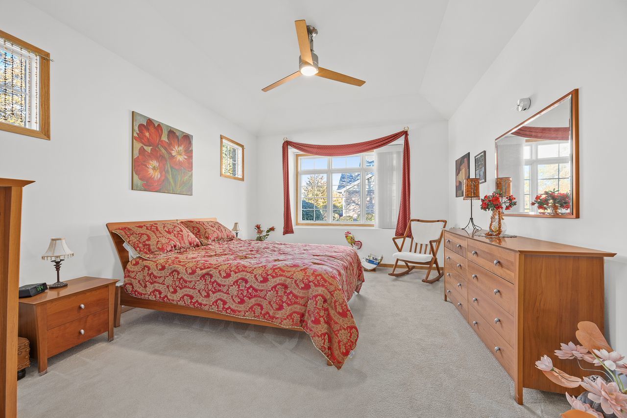 1343 Camelot Lane Lemont, IL 60439 - Photo 23 of 37 a bed room with a bed and a window