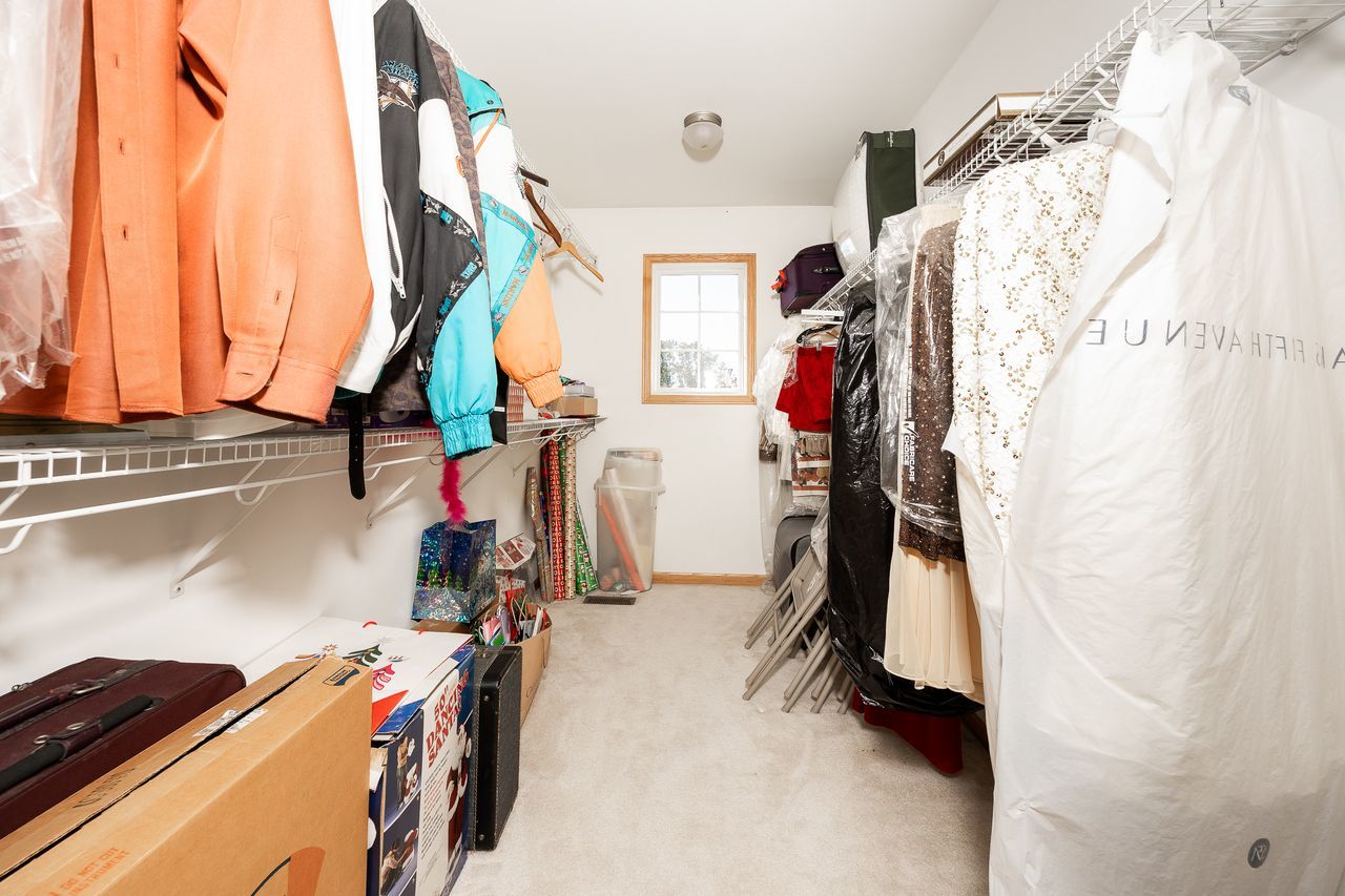 1343 Camelot Lane Lemont, IL 60439 - Photo 34 of 37 a view of walk in closet with clothes and shoes