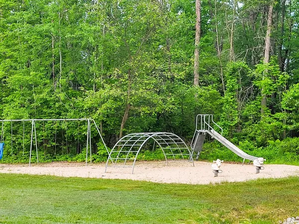 a view of a backyard with swimming pool