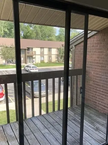 a view of wooden balcony with wooden floor