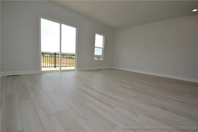 a kitchen with stainless steel appliances a stove a sink a microwave a refrigerator and cabinets