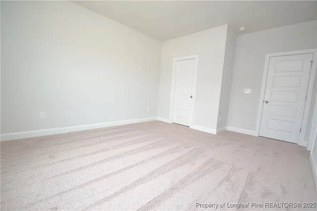 a bathroom with a double vanity sink a mirror and a window