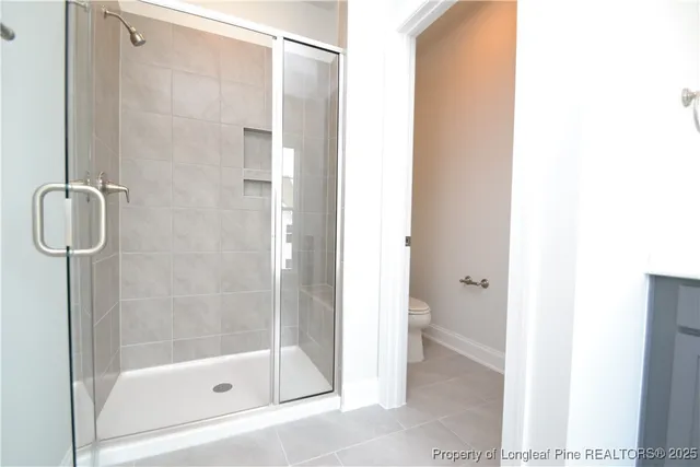 a spacious bathroom with a granite countertop sink mirror and