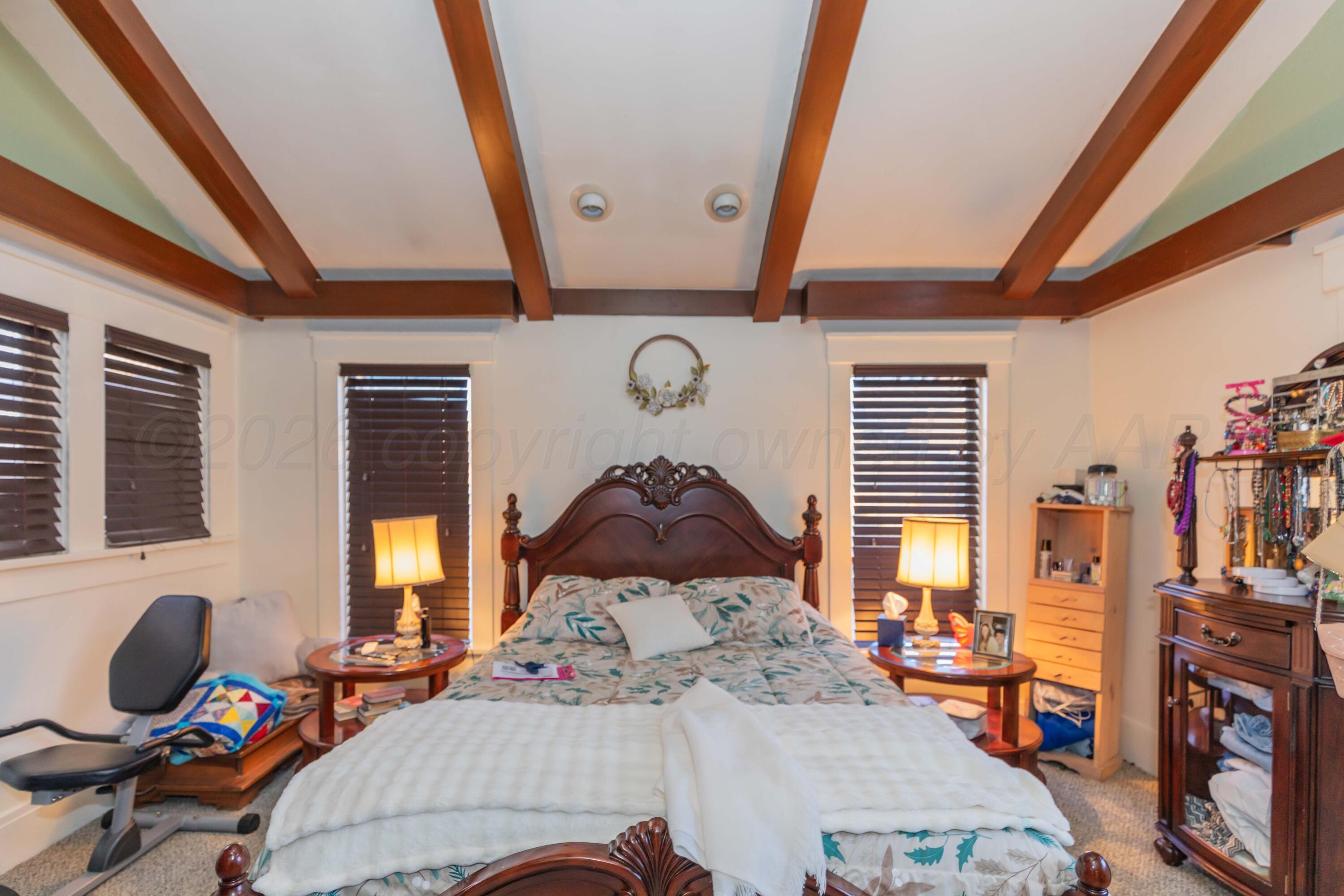 1502 South Monroe Street Amarillo, TX 79101 - Photo 11 of 35 a bedroom with furniture and a window