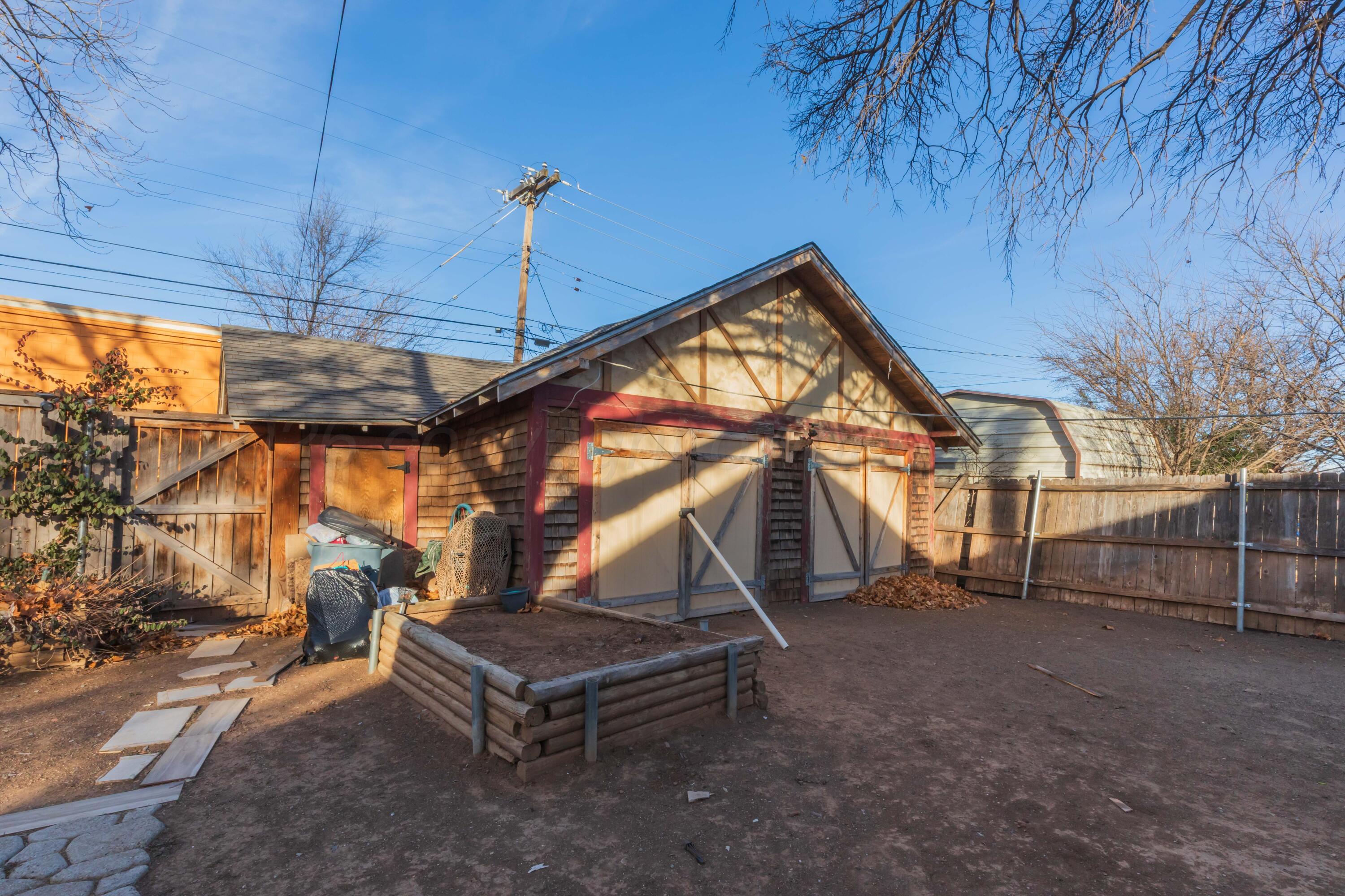 1502 South Monroe Street Amarillo, TX 79101 - Photo 14 of 35 a backyard of a house with barbeque oven table and chairs