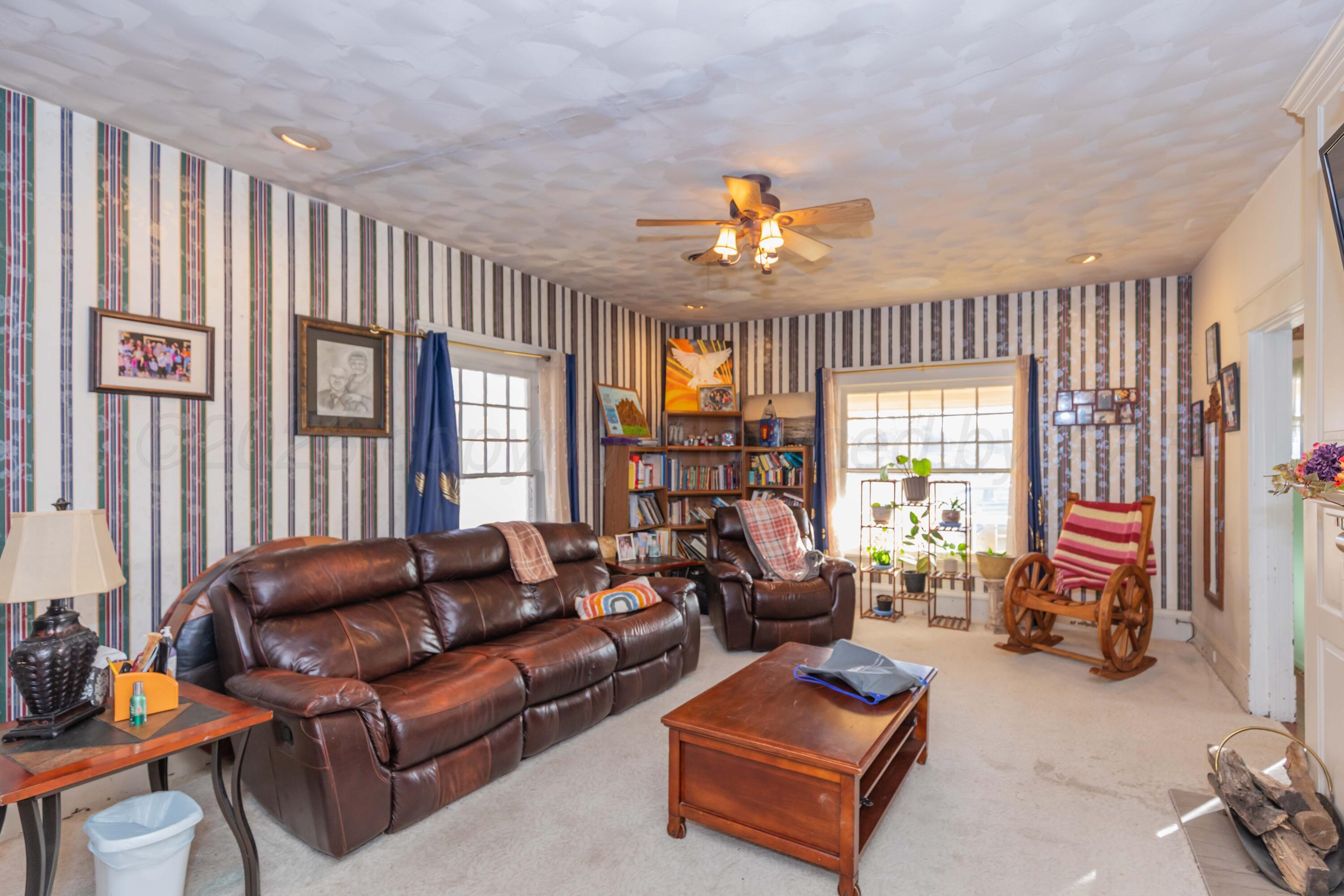 1502 South Monroe Street Amarillo, TX 79101 - Photo 17 of 35 a living room with furniture a fireplace and a window