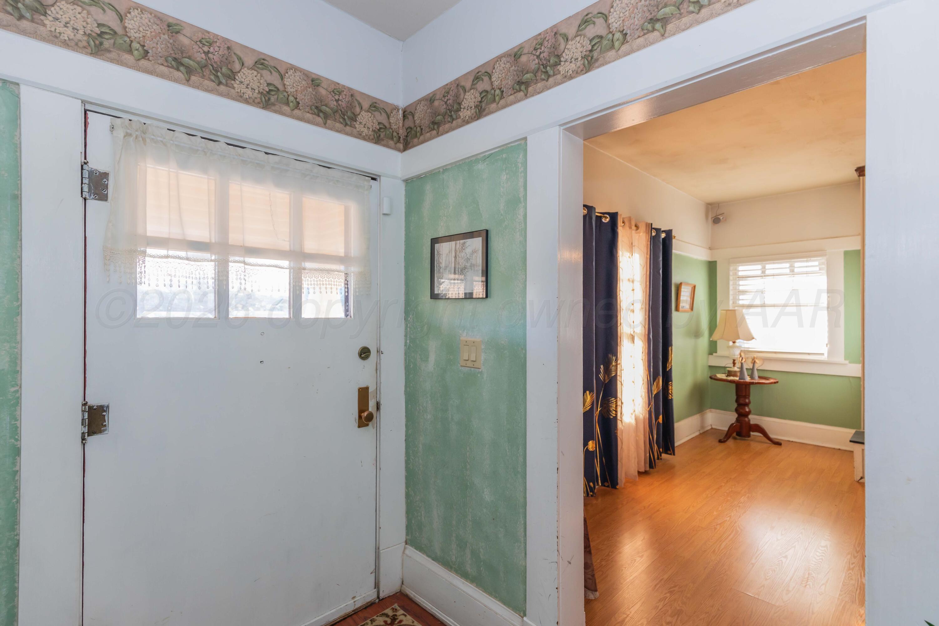 1502 South Monroe Street Amarillo, TX 79101 - Photo 2 of 35 a view of a room that has a bed and a window