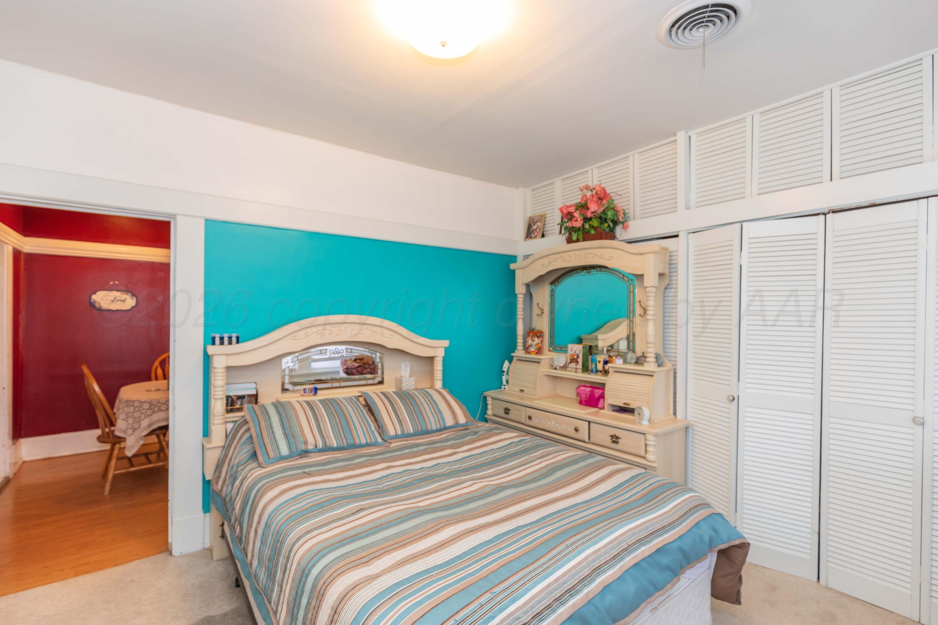 1502 South Monroe Street Amarillo, TX 79101 - Photo 26 of 35 a bedroom with a bed and a dresser