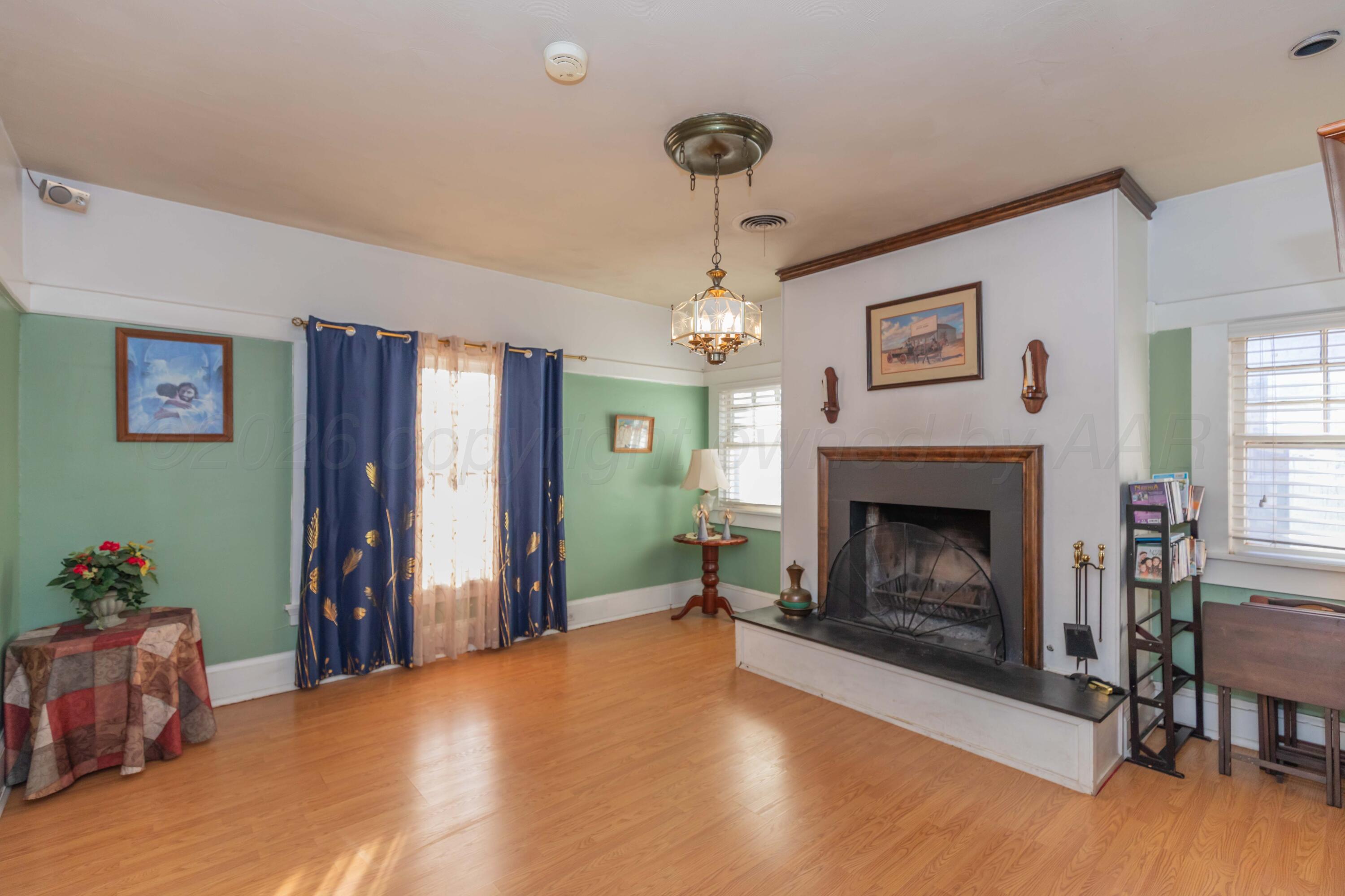 1502 South Monroe Street Amarillo, TX 79101 - Photo 27 of 35 a living room with furniture and a fireplace