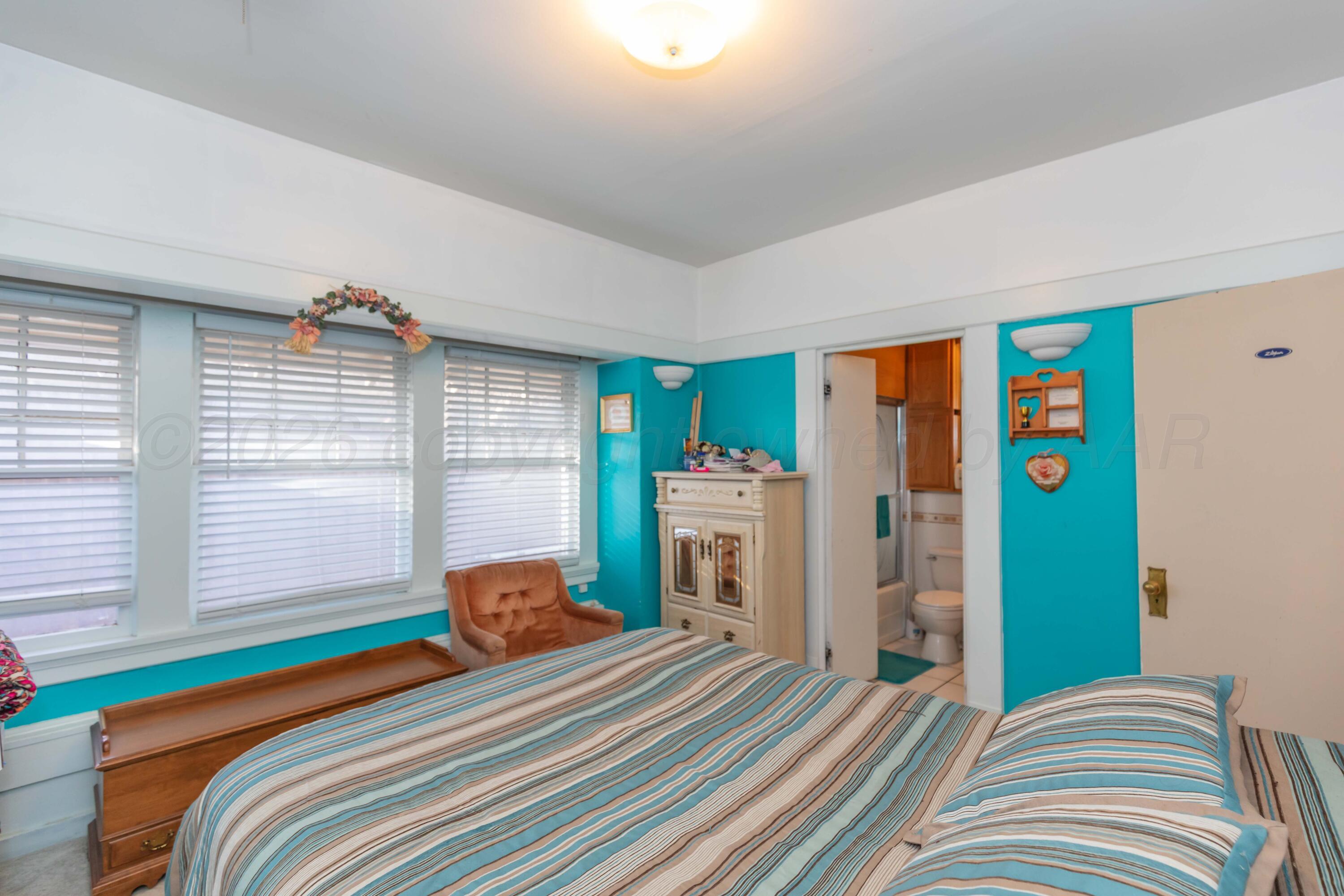 1502 South Monroe Street Amarillo, TX 79101 - Photo 28 of 35 a bedroom with a bed and a window