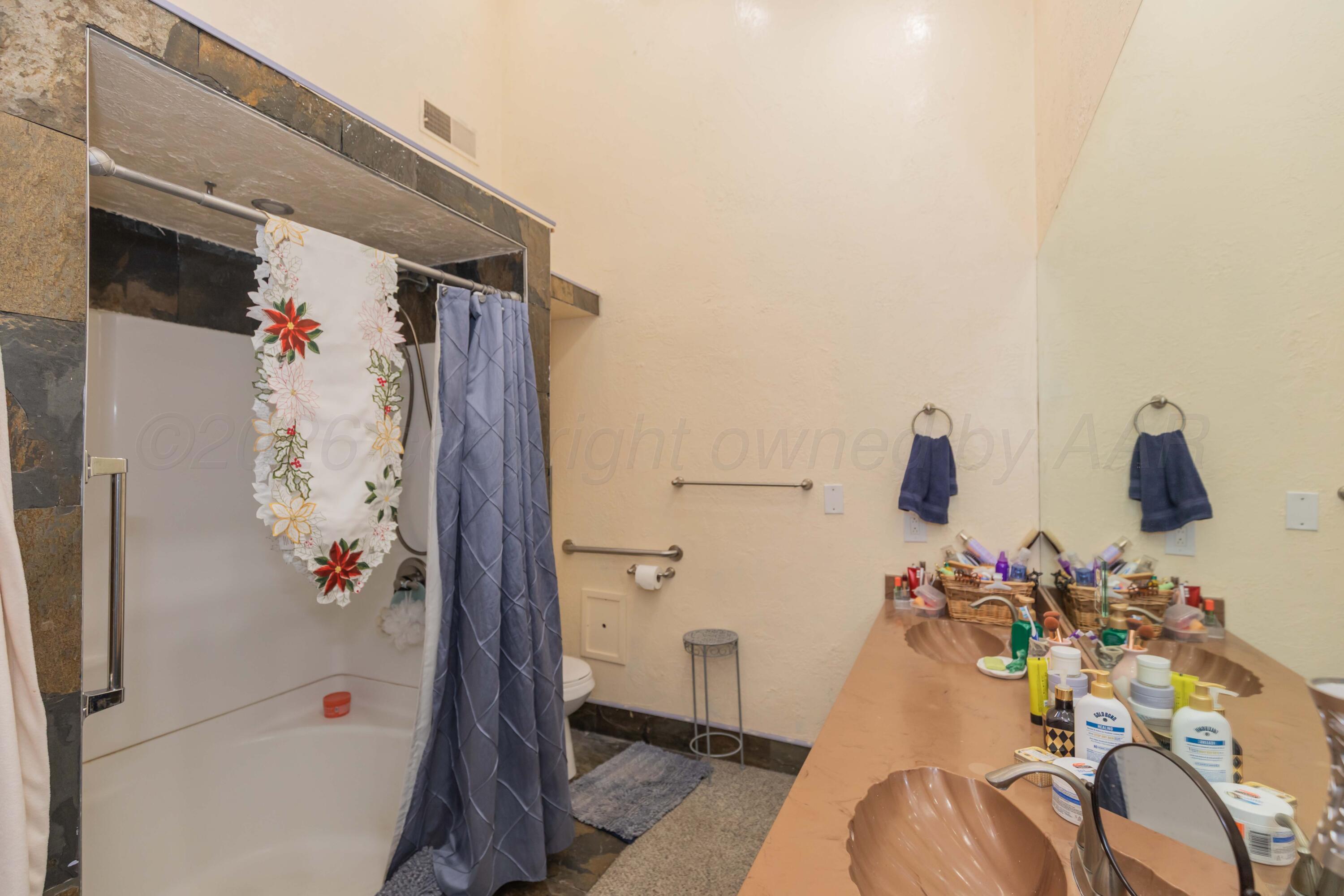 1502 South Monroe Street Amarillo, TX 79101 - Photo 32 of 35 a bathroom with a tub and shower view