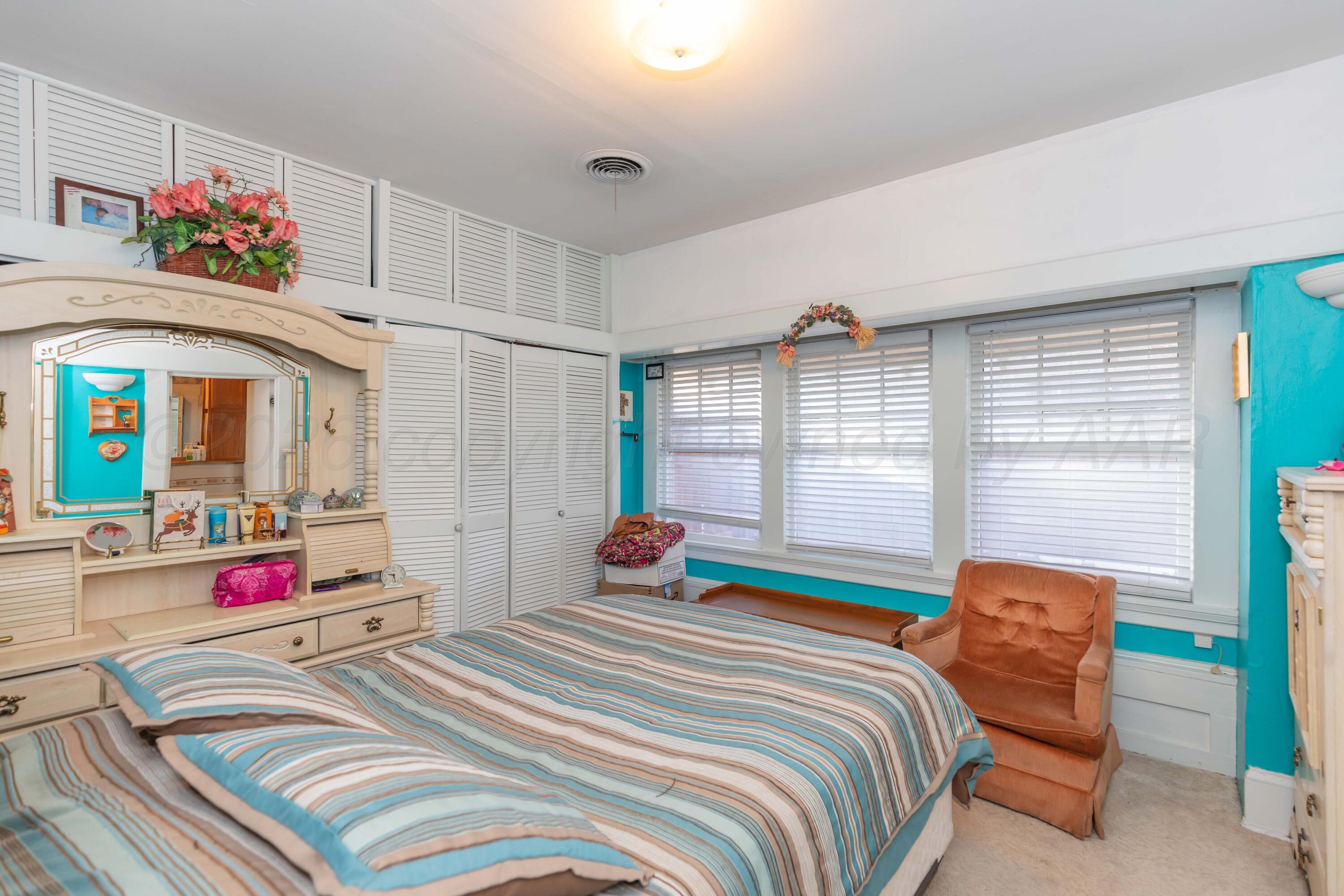 1502 South Monroe Street Amarillo, TX 79101 - Photo 7 of 35 a bedroom with a bed and a window