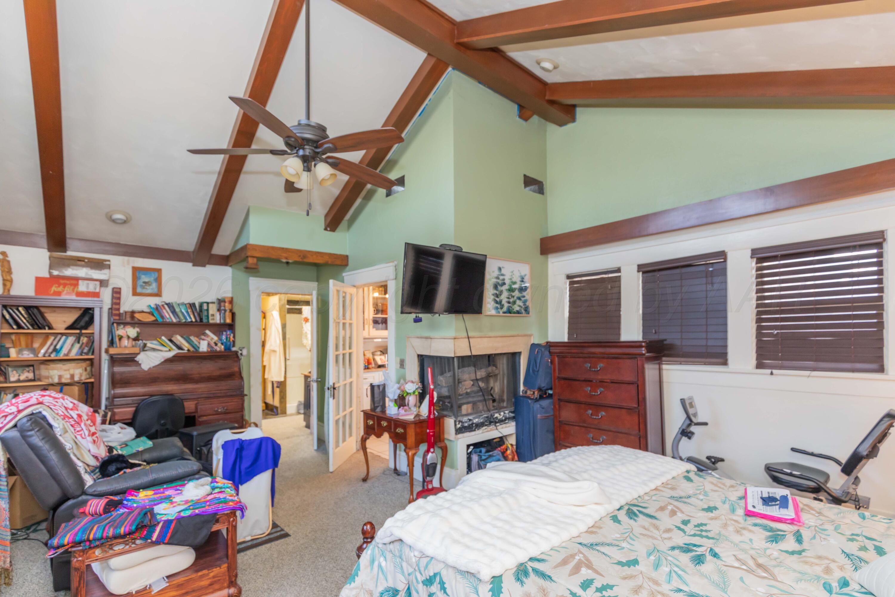 1502 South Monroe Street Amarillo, TX 79101 - Photo 9 of 35 a bedroom with furniture and a flat screen tv