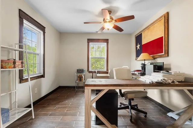 a view of an entryway with wooden floor