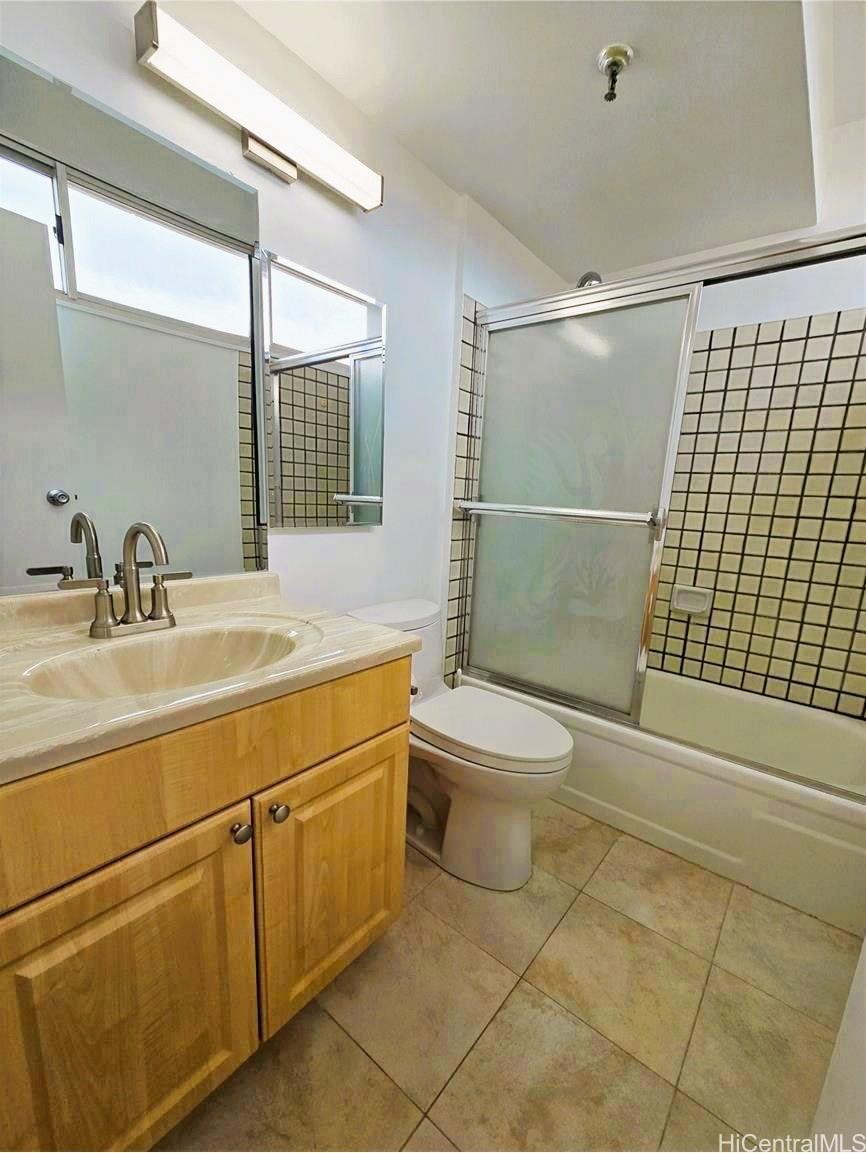 3033 Ala Ilima Street, Unit 1001 Honolulu, HI 96818 - Photo 8 of 12 a bathroom with a sink toilet and shower