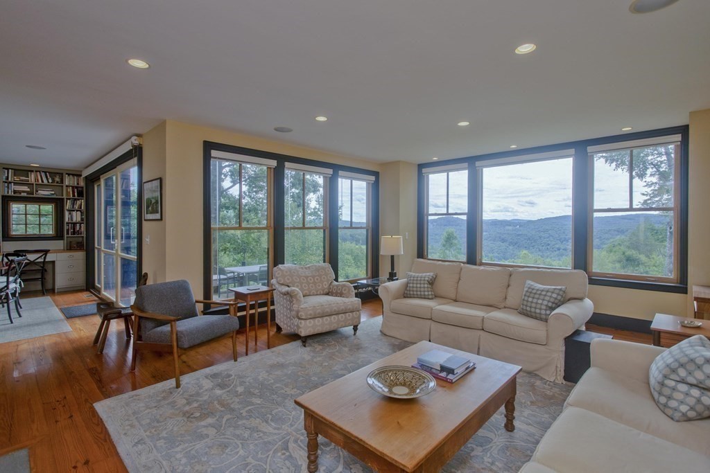 141 Franklin Hill Road Colrain, MA 01340 - Photo 11 of 42 a living room with furniture and a large window