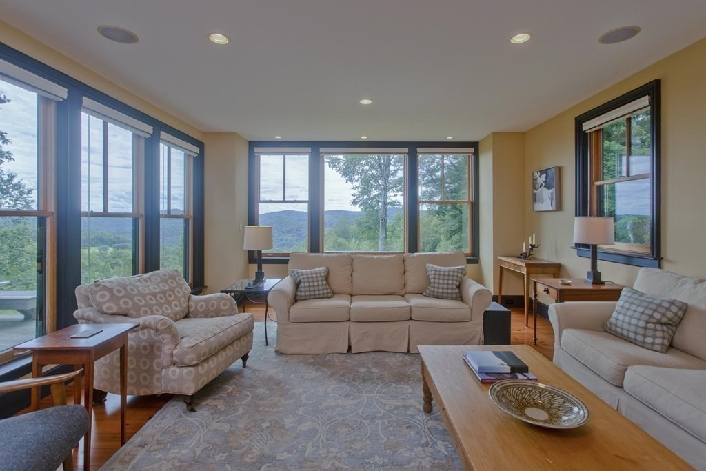 141 Franklin Hill Road Colrain, MA 01340 - Photo 12 of 42 a living room with furniture and a large window