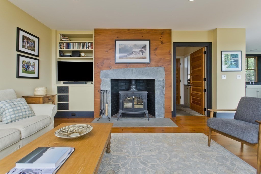 141 Franklin Hill Road Colrain, MA 01340 - Photo 14 of 42 a living room with furniture and a fireplace