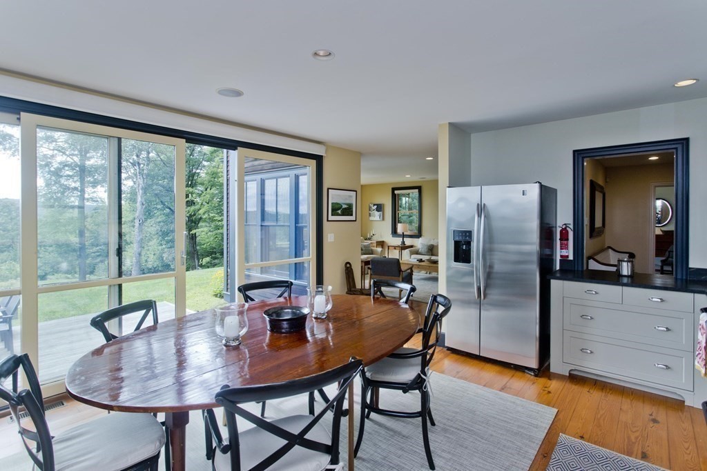 141 Franklin Hill Road Colrain, MA 01340 - Photo 16 of 42 a view of a dining room with furniture window and wooden floor