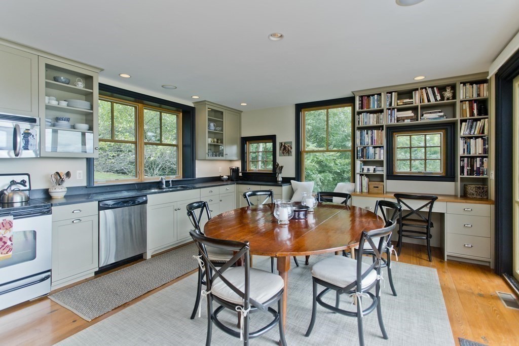 141 Franklin Hill Road Colrain, MA 01340 - Photo 18 of 42 a open dining room with stainless steel appliances kitchen island granite countertop furniture and a large window