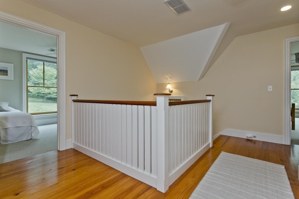 141 Franklin Hill Road Colrain, MA 01340 - Photo 22 of 42 a view of a hallway with wooden floor and cabinet