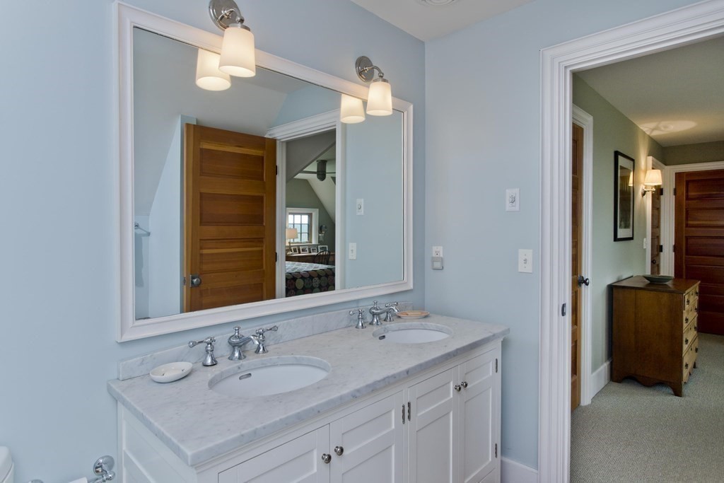141 Franklin Hill Road Colrain, MA 01340 - Photo 26 of 42 a en suite bathroom with a double vanity sink and a mirror