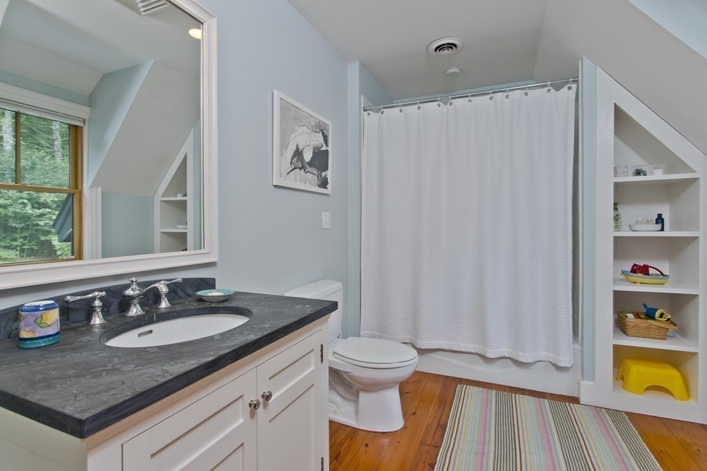 141 Franklin Hill Road Colrain, MA 01340 - Photo 30 of 42 a bathroom with a granite countertop sink and a mirror