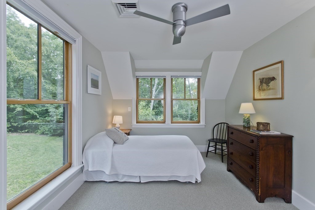 141 Franklin Hill Road Colrain, MA 01340 - Photo 31 of 42 a bedroom with a large bed and a window
