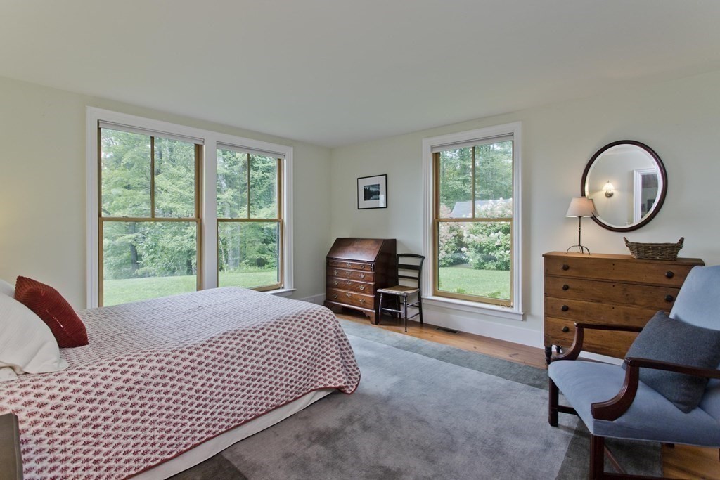 141 Franklin Hill Road Colrain, MA 01340 - Photo 33 of 42 a bed room with a bed chair and a window