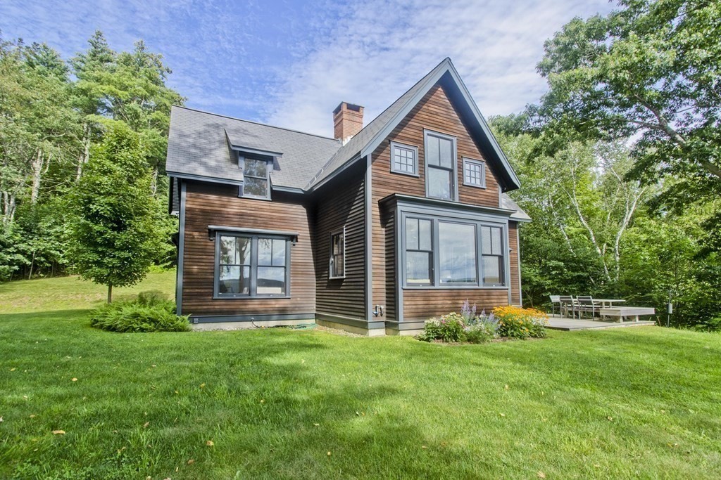141 Franklin Hill Road Colrain, MA 01340 - Photo 38 of 42 a front view of a house with a yard and trees