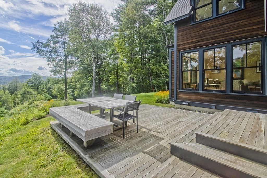 141 Franklin Hill Road Colrain, MA 01340 - Photo 5 of 42 a view of a wooden deck and a patio