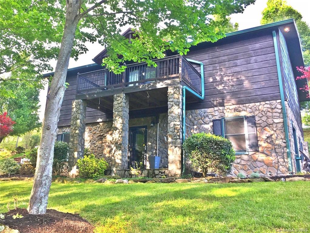 2156 Orchard Road, Unit 1 & 2 Deep Gap, NC 28618 - Photo 1 of 33 a front view of a house with a garden