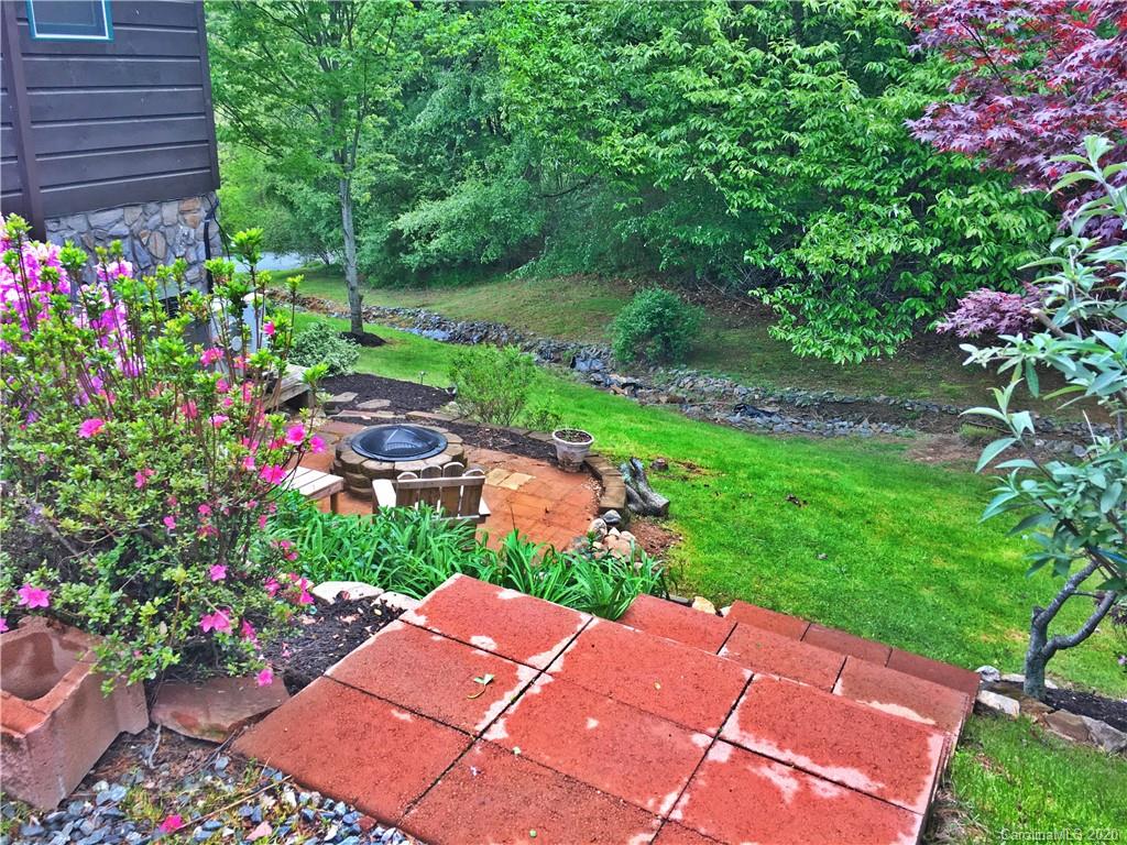 2156 Orchard Road, Unit 1 & 2 Deep Gap, NC 28618 - Photo 14 of 33 a garden view with a seating space
