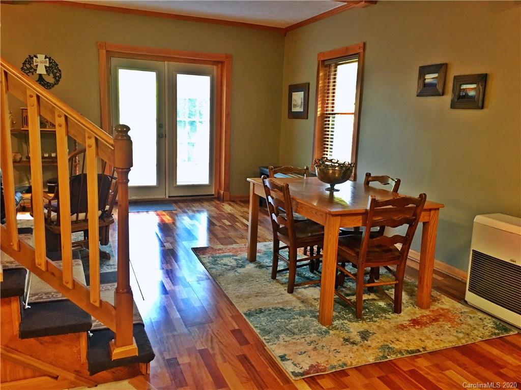 2156 Orchard Road, Unit 1 & 2 Deep Gap, NC 28618 - Photo 18 of 33 a view of a dining room with furniture window and wooden floor