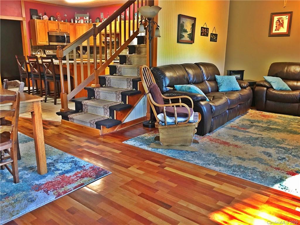 2156 Orchard Road, Unit 1 & 2 Deep Gap, NC 28618 - Photo 19 of 33 a living room with lots of furniture and a rug