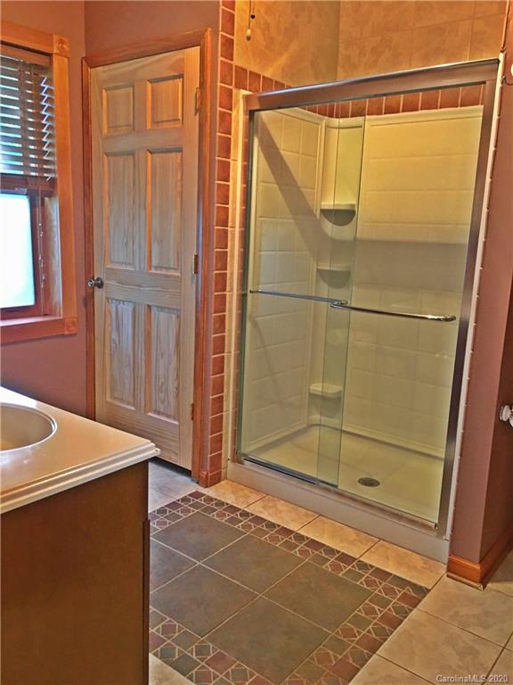 2156 Orchard Road, Unit 1 & 2 Deep Gap, NC 28618 - Photo 24 of 33 a bathroom with a shower and a sink