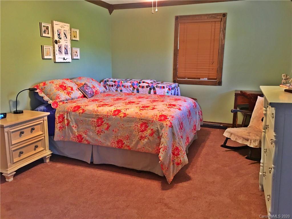 2156 Orchard Road, Unit 1 & 2 Deep Gap, NC 28618 - Photo 27 of 33 a bedroom with a bed and a window