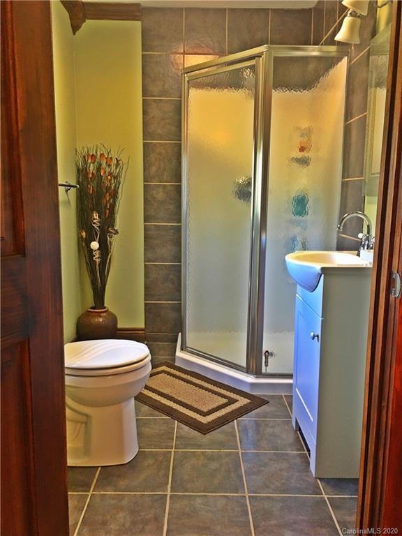 2156 Orchard Road, Unit 1 & 2 Deep Gap, NC 28618 - Photo 28 of 33 a bathroom with a toilet and a shower