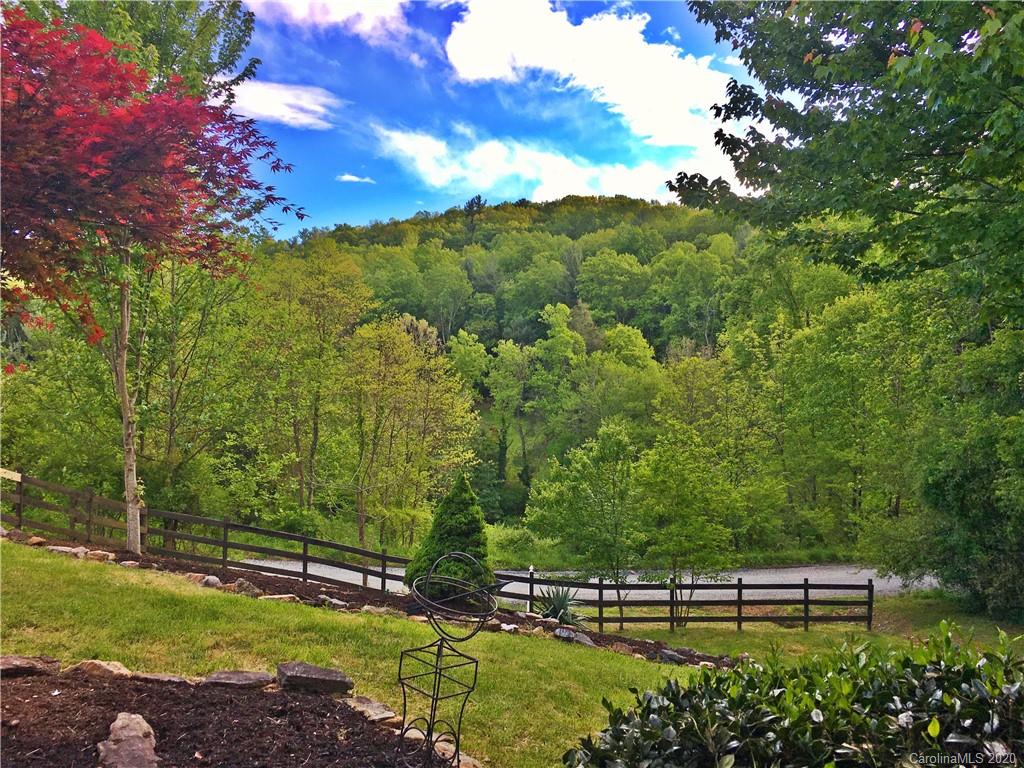 2156 Orchard Road, Unit 1 & 2 Deep Gap, NC 28618 - Photo 8 of 33 a view of a yard with a tree