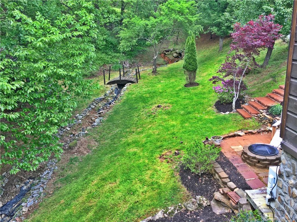 2156 Orchard Road, Unit 1 & 2 Deep Gap, NC 28618 - Photo 9 of 33 a backyard of a house with a yard and outdoor seating
